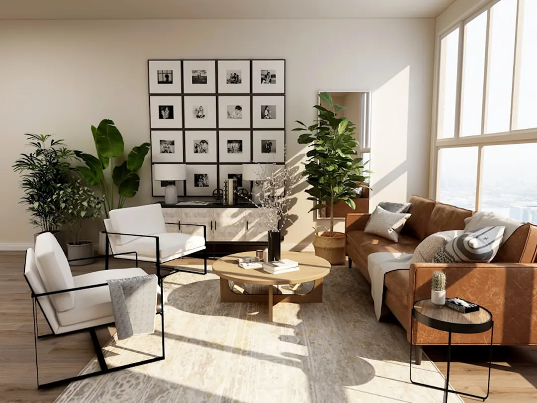 Sunlit living room with leather chairs and a gallery wall